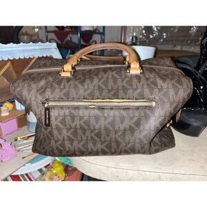 Michael Kors Kirby large satchel in brown monogram printed pebble leather.